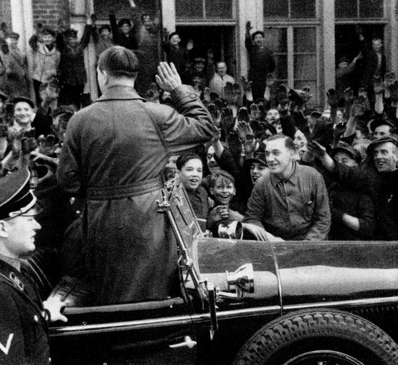 Adolf Hitler salutes workers in front of the Krupps factory in Essen